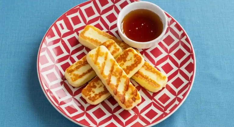Halloumi sticks with PERi honey sauce in a plate